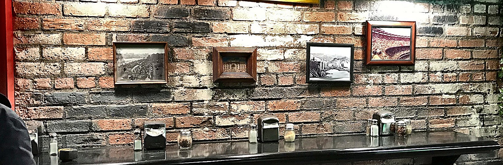 Aged brick wall with weathered plaster