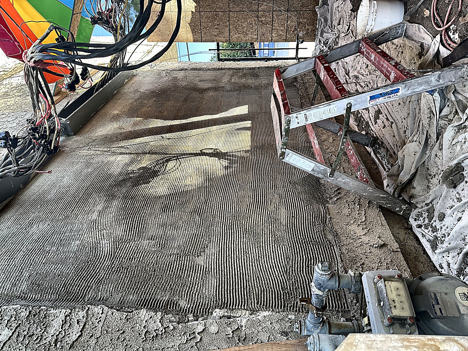 Restored lath and plaster wall with hand-troweled texture